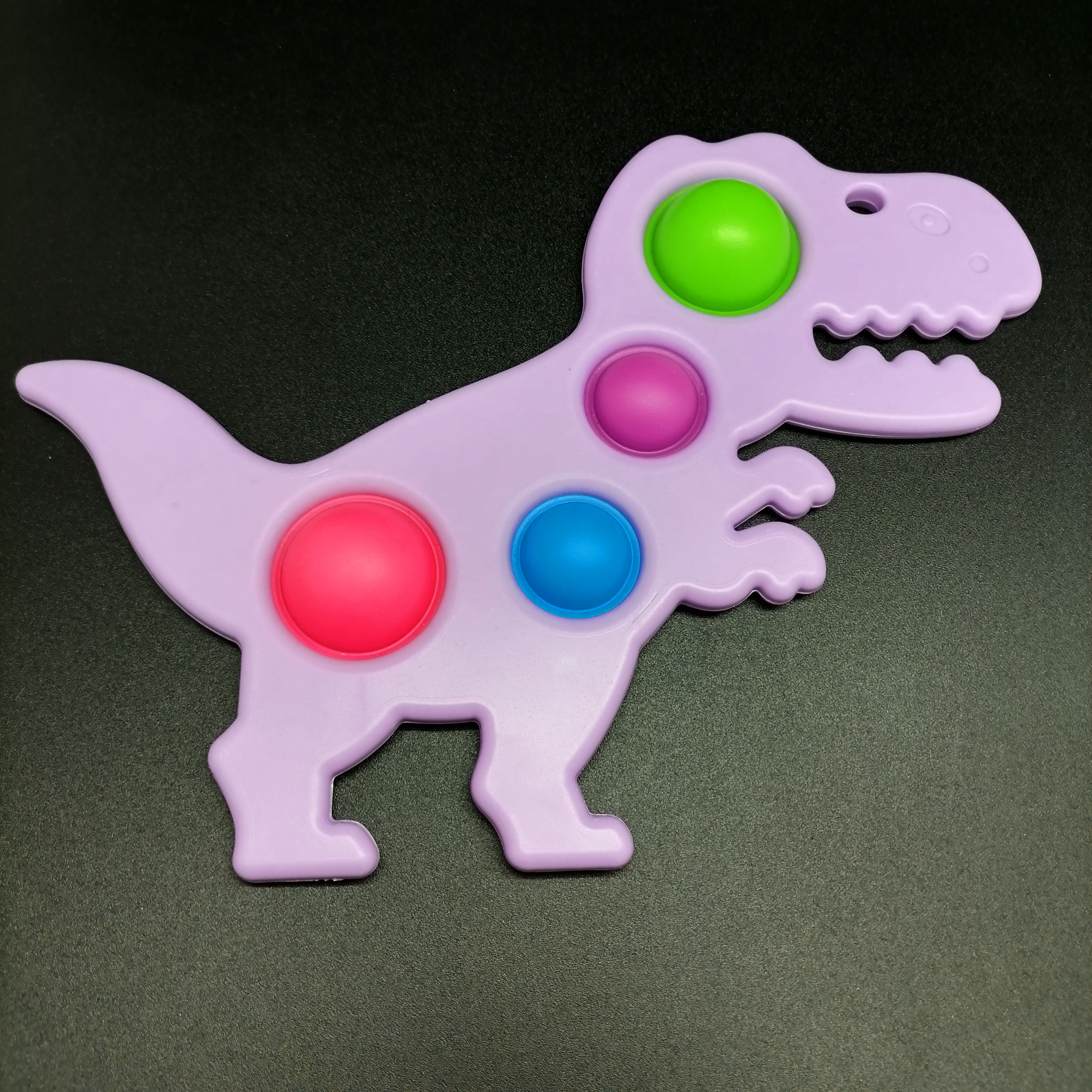 картинка Сенсорная игрушка антистресс Simple Dimple- Динозавр 21х14 см Pop it-48 от магазина El Corazon