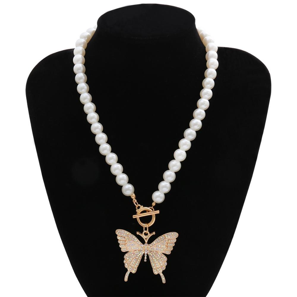 картинка Ожерелье из белых бусин с подвеской бабочка от магазина El Corazon