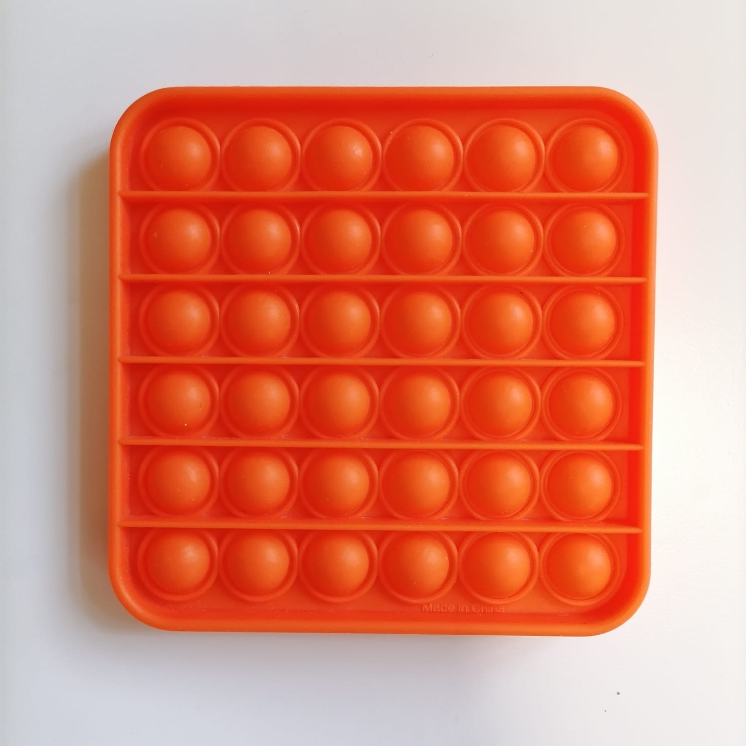 картинка Сенсорная игрушка антистресс Pop it- Оранжевый квадрат 12х12 см Popit59  от магазина El Corazon