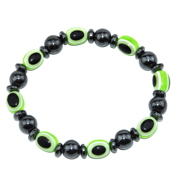 картинка Черный магнитный браслет для похудения с зелеными камнями от магазина El Corazon